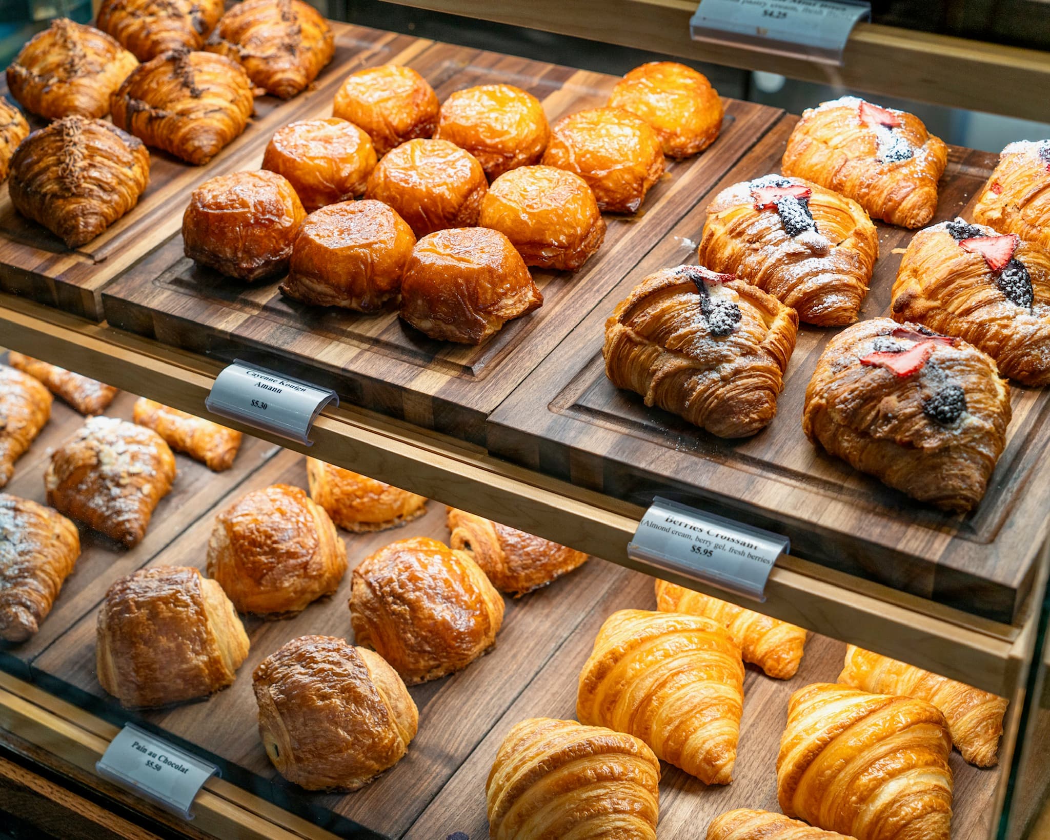 Bakery display showing amann, berries croissants and plain croissants